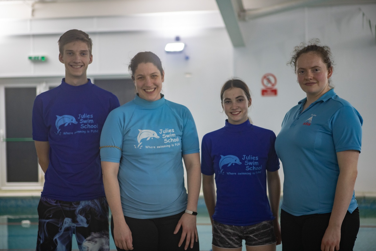 A swimmer grinning after a lesson